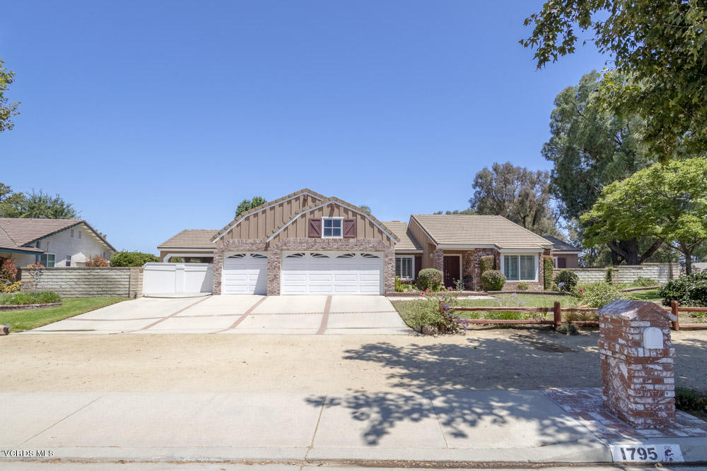 1795 Rambling Road Simi Valley, CA 93065 - Photo 2 of 60 a front view of a house with a yard