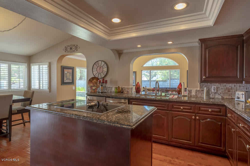 1795 Rambling Road Simi Valley, CA 93065 - Photo 15 of 60 a kitchen with sink a window and dining table