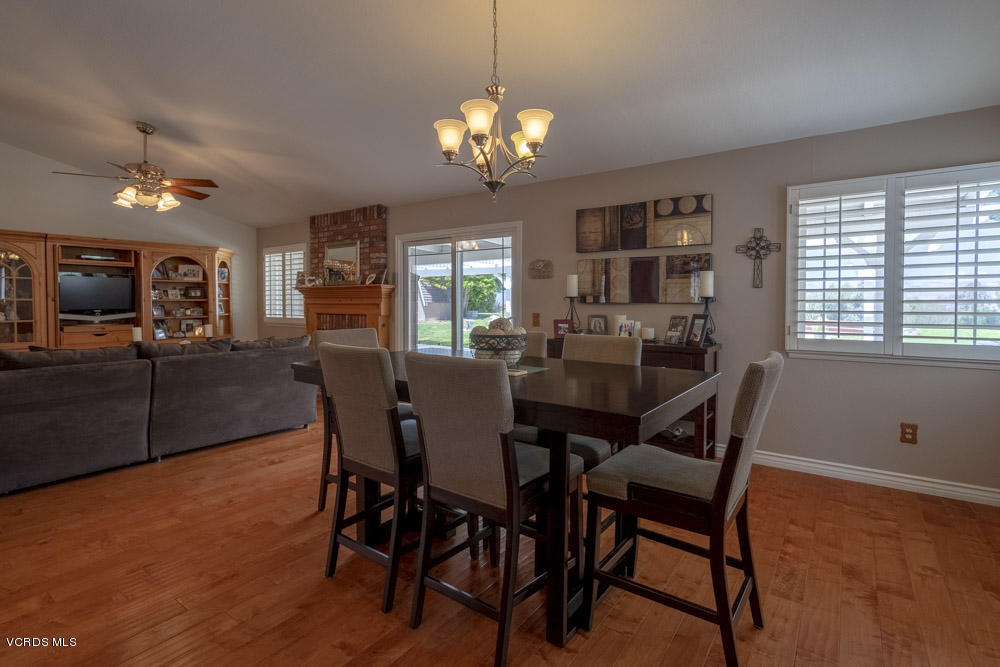 1795 Rambling Road Simi Valley, CA 93065 - Photo 21 of 60 a view of a dining room with furniture window and wooden floor