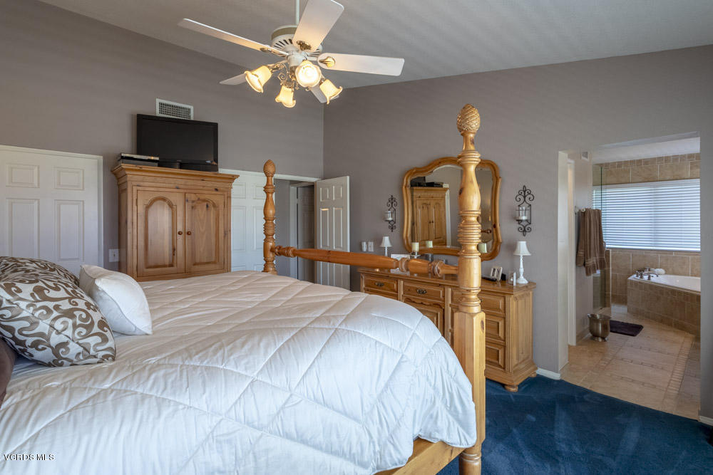 1795 Rambling Road Simi Valley, CA 93065 - Photo 29 of 60 a bedroom with a bed and a flat tv screen on dresser