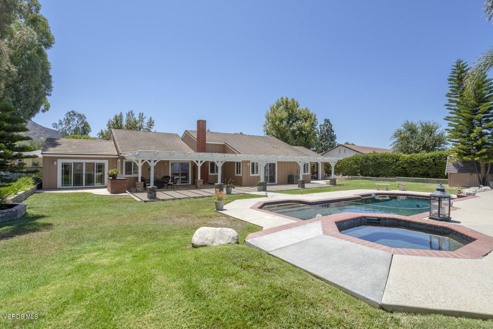 1795 Rambling Road Simi Valley, CA 93065 - Photo 44 of 60 a view of a house with swimming pool and yard