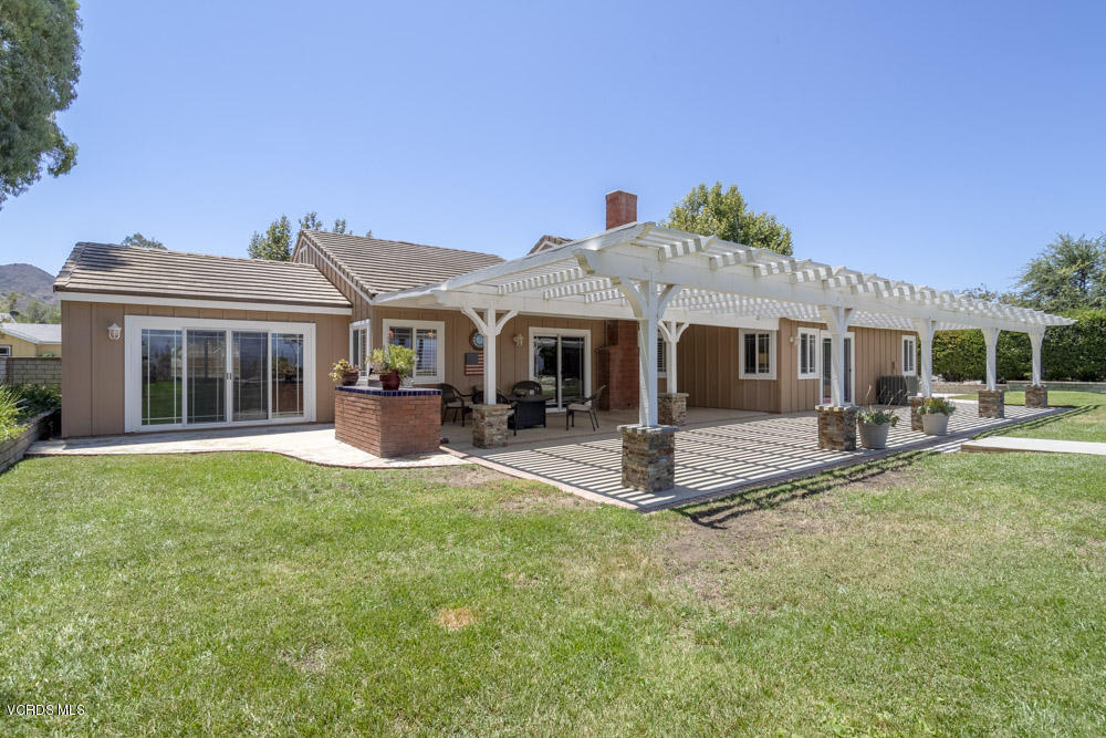 1795 Rambling Road Simi Valley, CA 93065 - Photo 49 of 60 a front view of a house with sitting area and garden