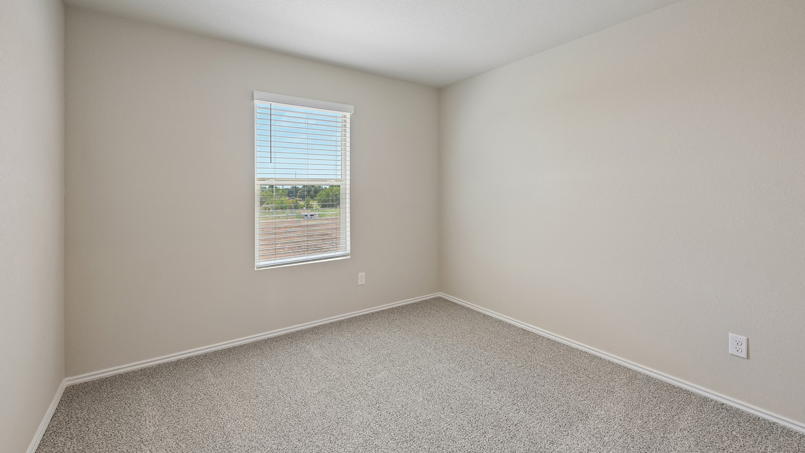 372 Old Stage Coach Road Jarrell, TX 76537 - Photo 19 of 25 Soft carpeting underfoot and neutral walls define this versatile secondary space.