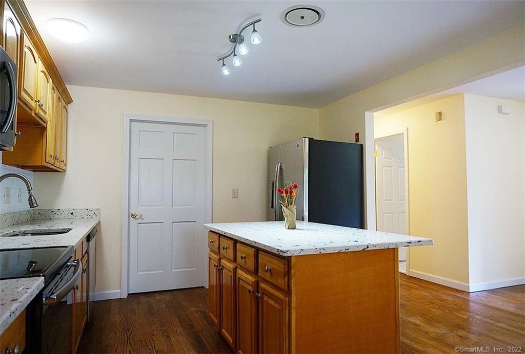 26 Rex Road Lisbon, CT 06351 - Photo 1 of 1 a kitchen with stainless steel appliances granite countertop a sink stove and refrigerator