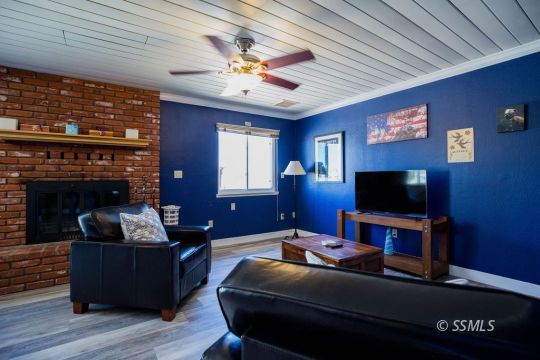 2030 South Inyo Street Ridgecrest, CA 93555 - Photo 17 of 42 a living room with furniture and a flat screen tv
