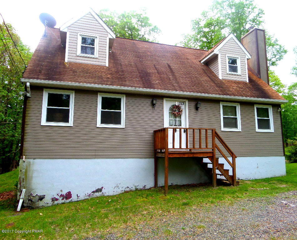 113 Lehman Road Bushkill, PA 18324 - Photo 1 of 23 a front view of a house with a garden and deck