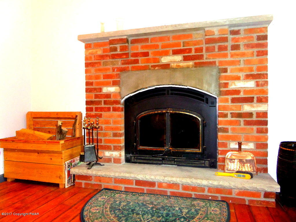 113 Lehman Road Bushkill, PA 18324 - Photo 11 of 23 a view of fireplace and window