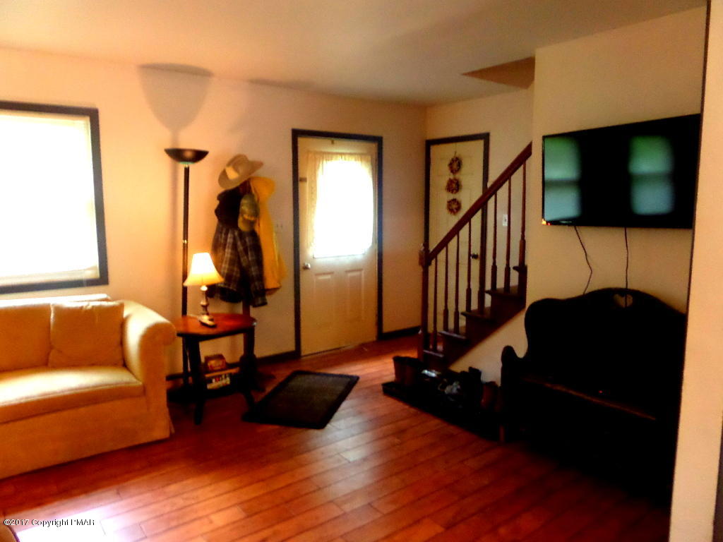 113 Lehman Road Bushkill, PA 18324 - Photo 15 of 23 a living room with furniture flat screen tv and a couch