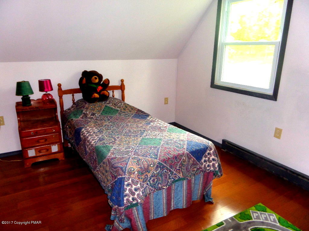 113 Lehman Road Bushkill, PA 18324 - Photo 21 of 23 a bedroom with a bed and a window