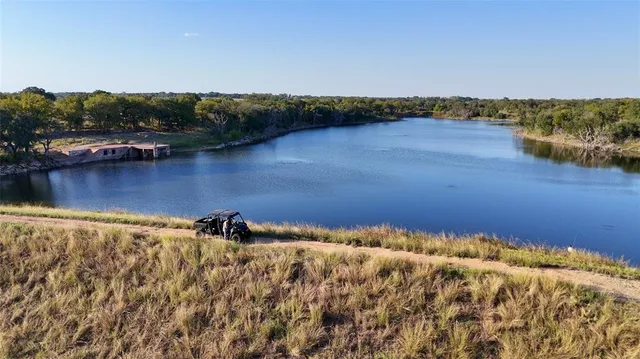 an aerial view of a houses with ocean view