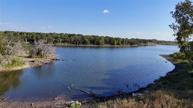 a view of a lake with houses with outdoor space