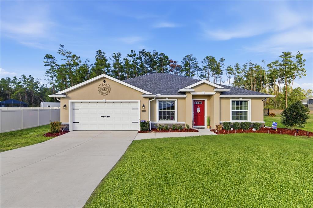 9609 Southwest 40th Terrace Ocala, FL 34476 - Photo 1 of 28 a front view of house with yard and green space