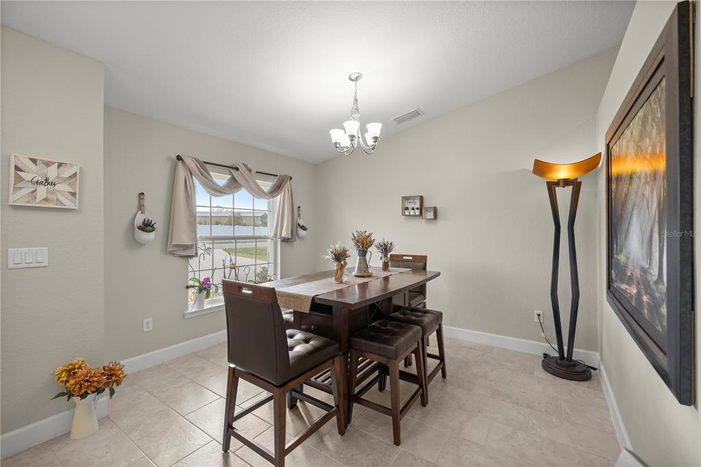 9609 Southwest 40th Terrace Ocala, FL 34476 - Photo 12 of 28 a dining room with furniture and window