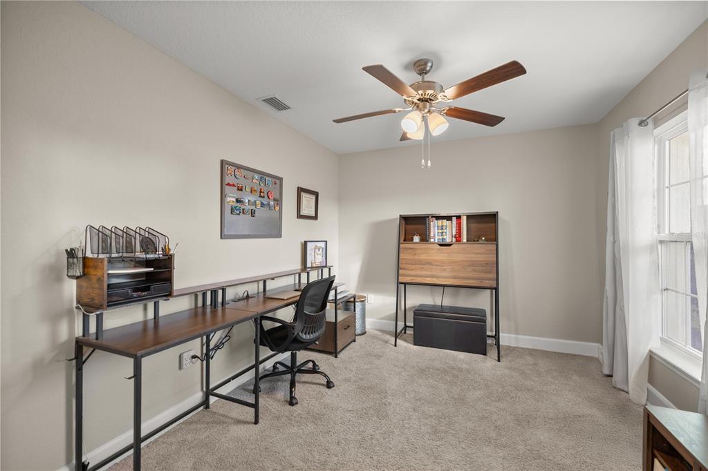 9609 Southwest 40th Terrace Ocala, FL 34476 - Photo 14 of 28 a workspace with a desk and chair