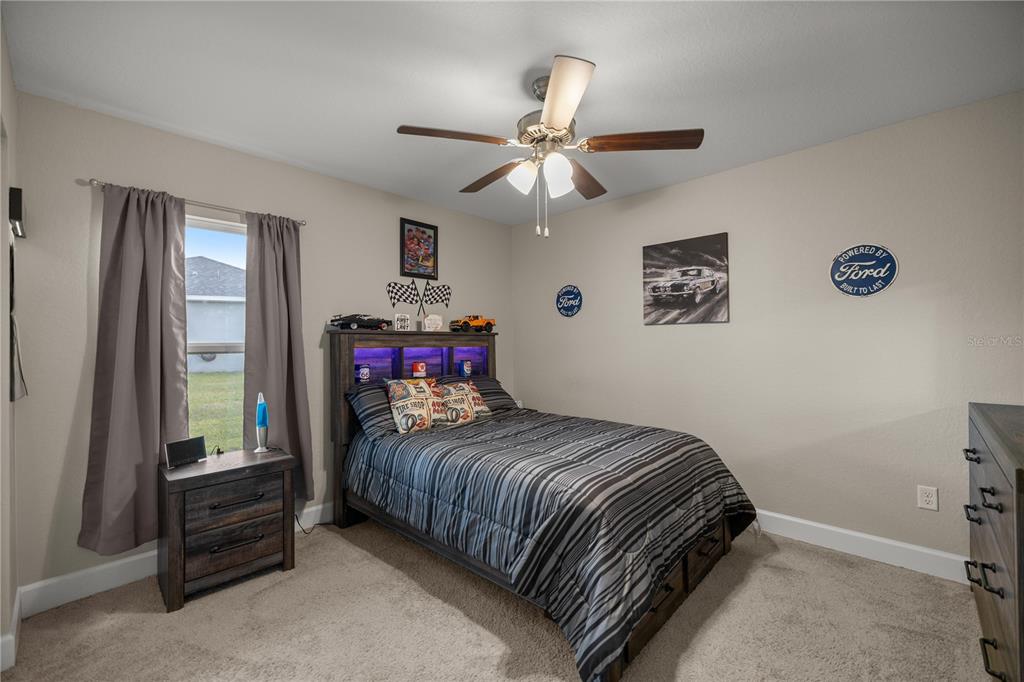 9609 Southwest 40th Terrace Ocala, FL 34476 - Photo 19 of 28 a bedroom with a bed and a window