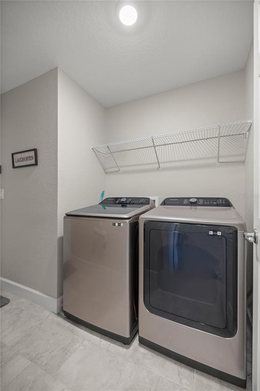 9609 Southwest 40th Terrace Ocala, FL 34476 - Photo 24 of 28 a utility room with washer and dryer