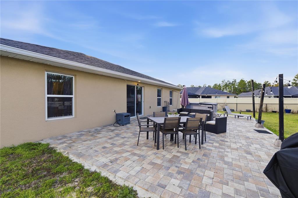 9609 Southwest 40th Terrace Ocala, FL 34476 - Photo 25 of 28 a view of a patio with dining table and chairs