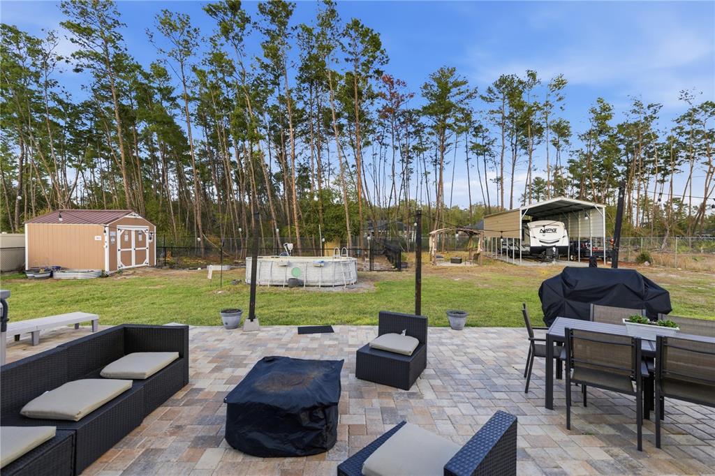 9609 Southwest 40th Terrace Ocala, FL 34476 - Photo 26 of 28 a view of a garden and patio