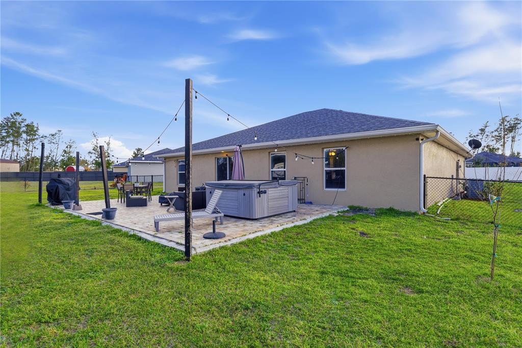 9609 Southwest 40th Terrace Ocala, FL 34476 - Photo 27 of 28 a view of a house with a backyard