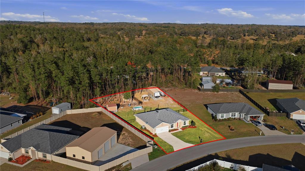 9609 Southwest 40th Terrace Ocala, FL 34476 - Photo 5 of 28 an aerial view of a house with a yard