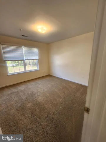 an empty room with a windows