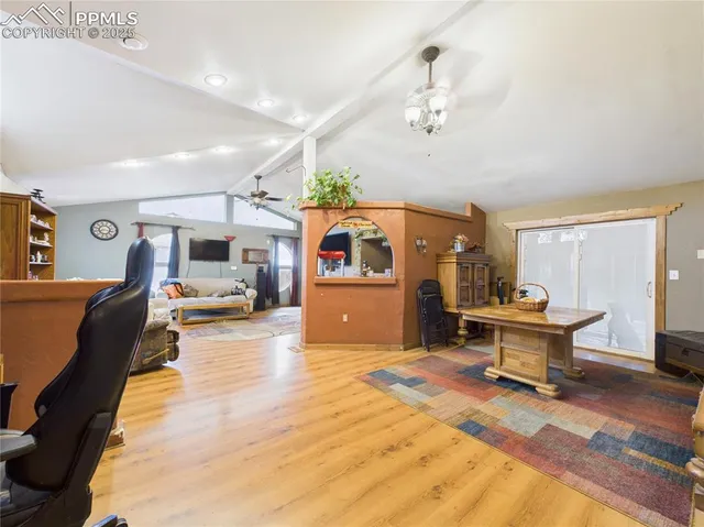 a living room with furniture and a table