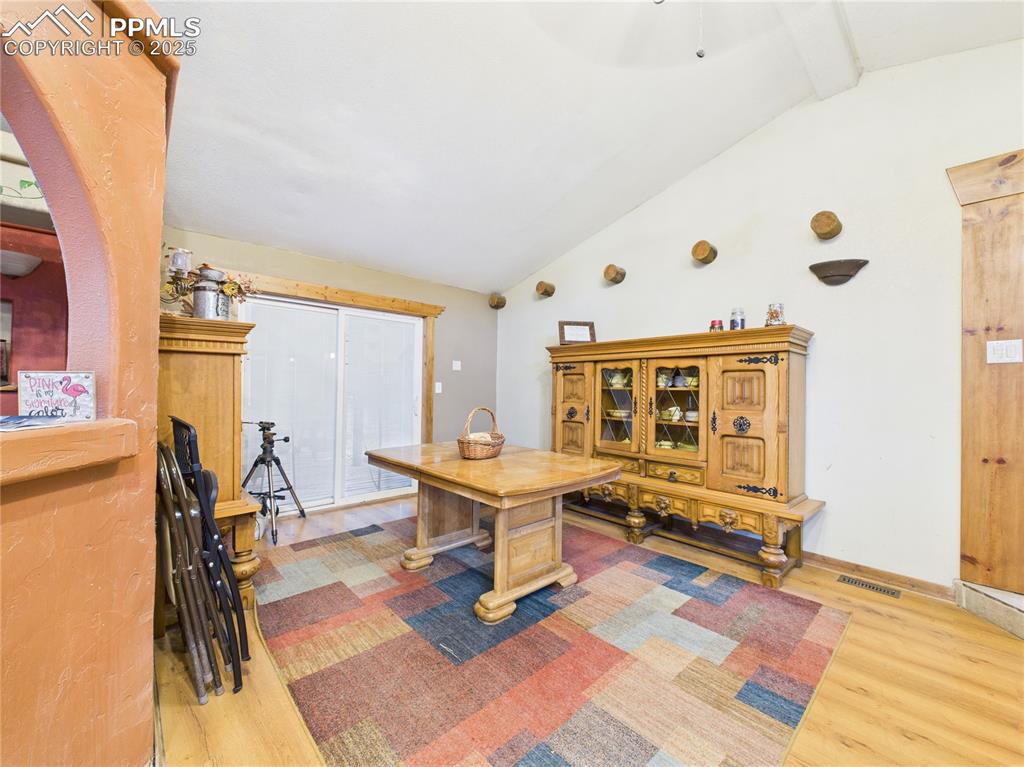 206 Lucille Street Avondale, CO 81022 - Photo 13 of 36 a living room with a table and a couch