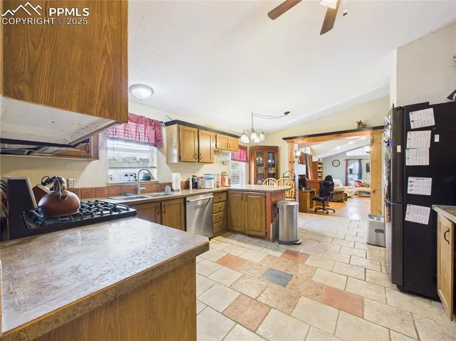 a kitchen with lots of counter top space and appliances