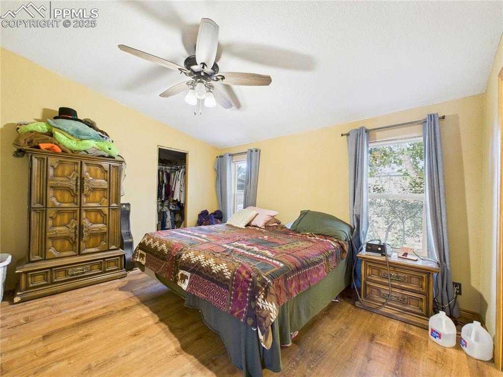 206 Lucille Street Avondale, CO 81022 - Photo 20 of 36 a bedroom with a bed and a window