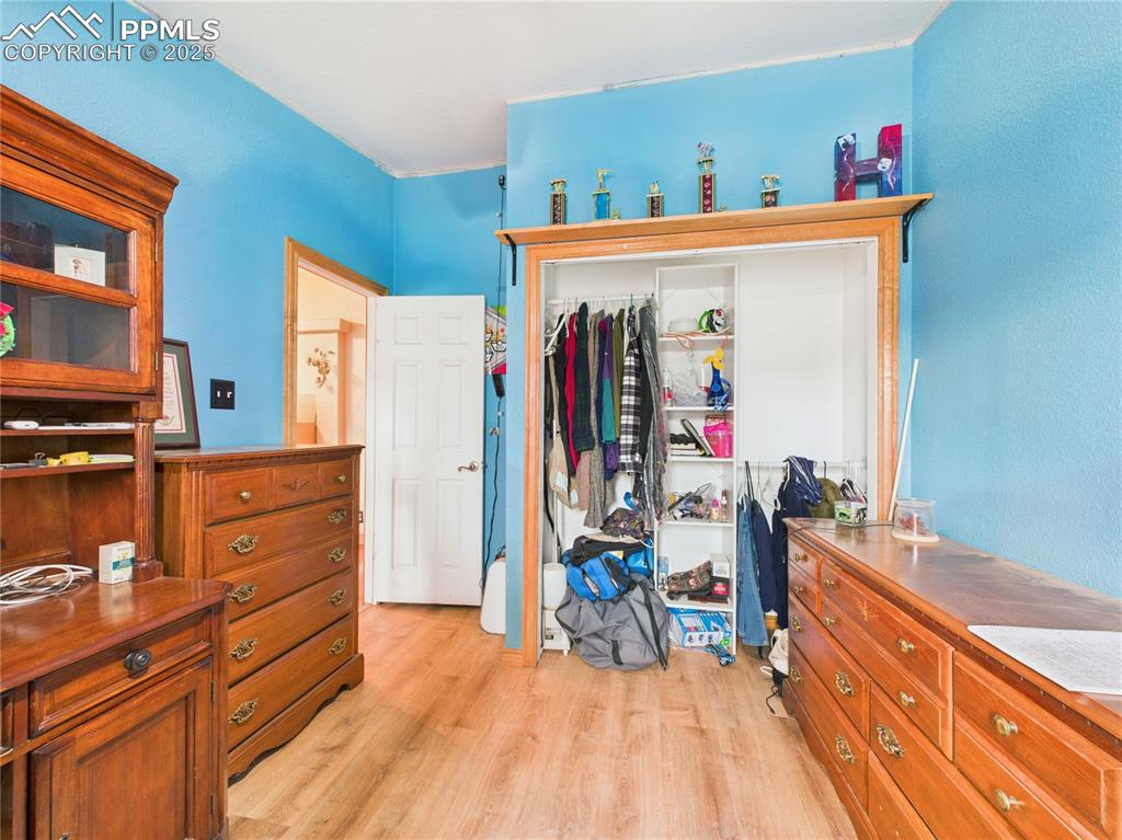 206 Lucille Street Avondale, CO 81022 - Photo 28 of 36 a view of a kitchen with furniture and wooden floor