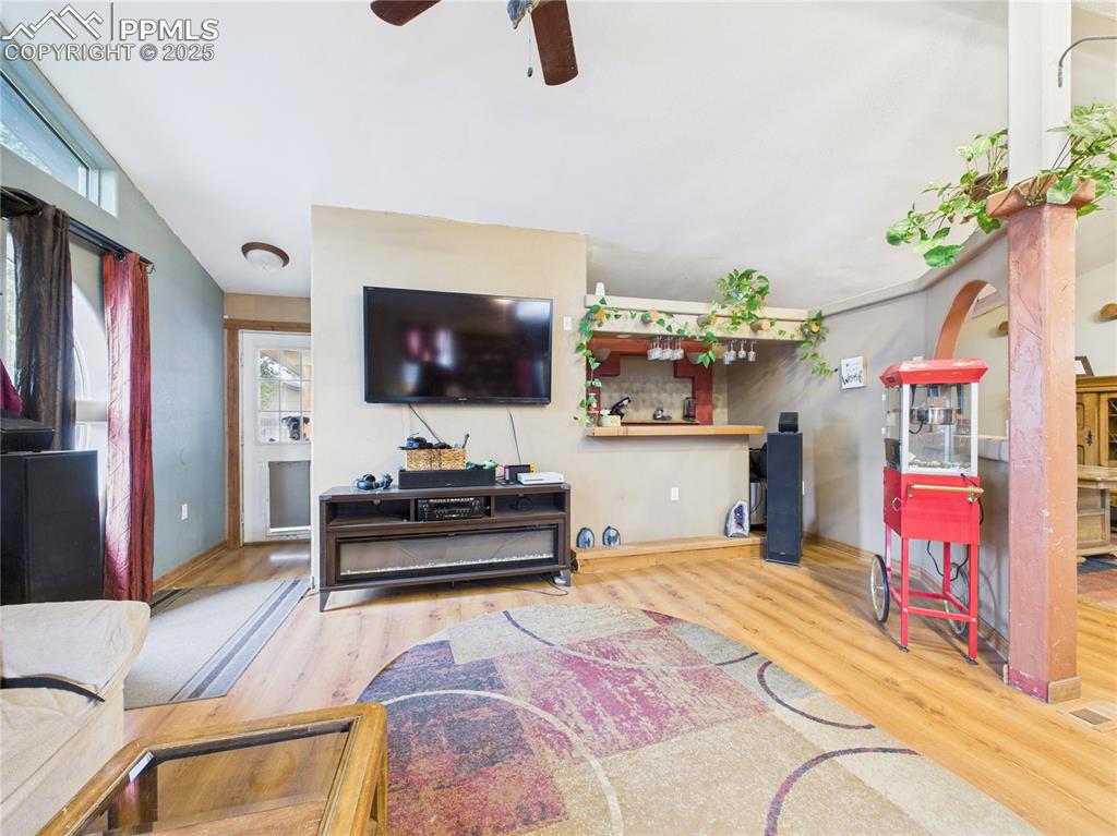 206 Lucille Street Avondale, CO 81022 - Photo 7 of 36 a living room with furniture and a flat screen tv