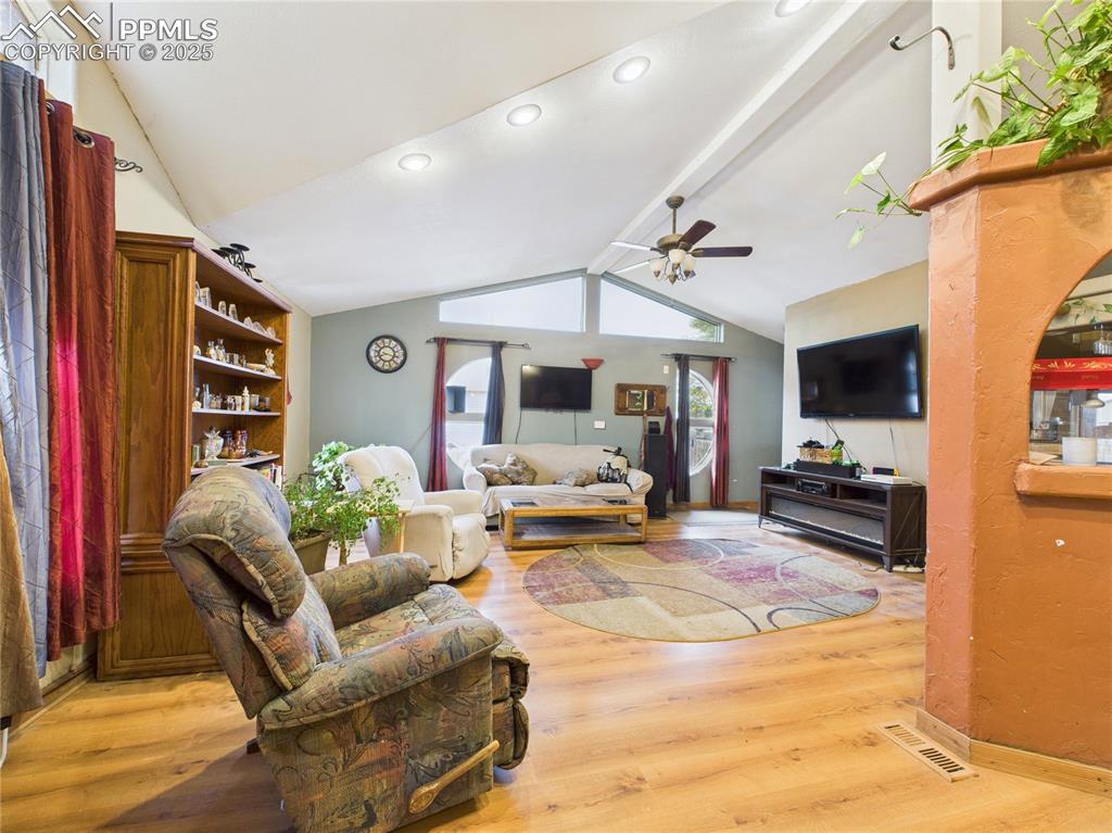 206 Lucille Street Avondale, CO 81022 - Photo 10 of 36 a living room with furniture and a flat screen tv