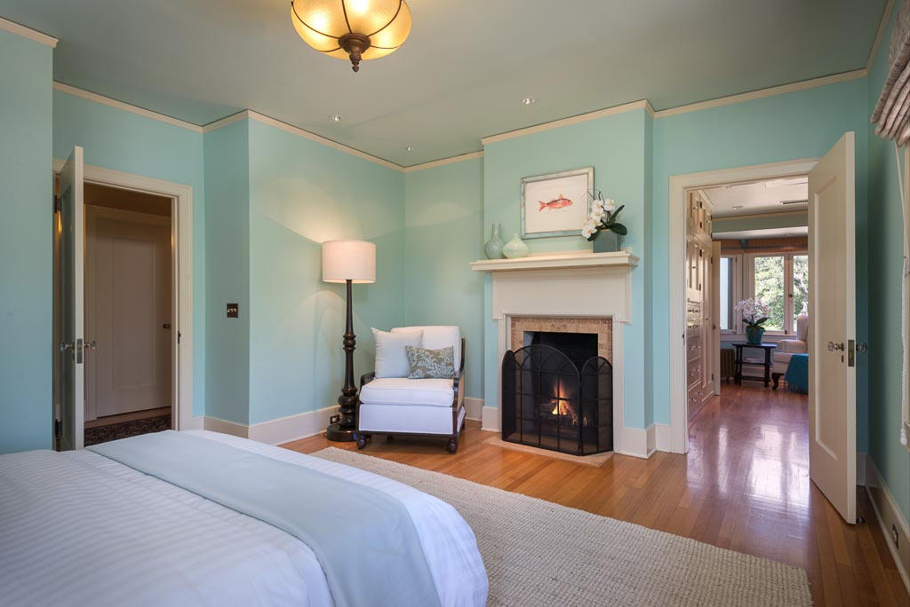 699 San Ysidro Road Montecito, CA 93108 - Photo 15 of 36 a bedroom with a bed and a chandelier