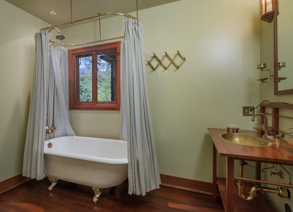 699 San Ysidro Road Montecito, CA 93108 - Photo 28 of 36 a bathroom with a sink a mirror and a toilet