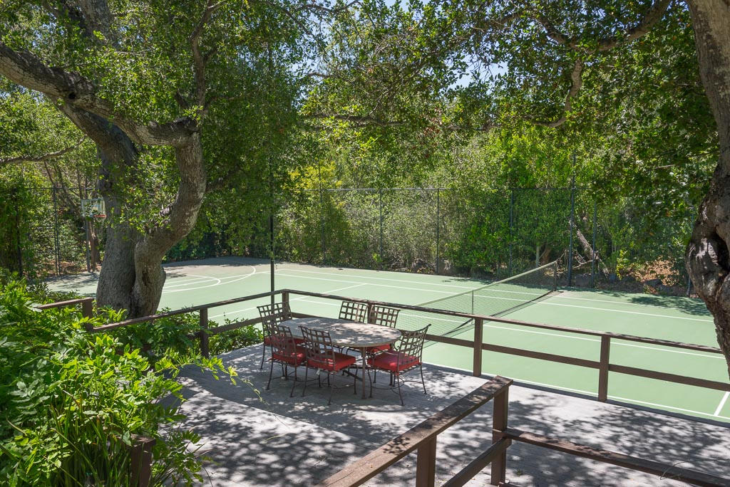 699 San Ysidro Road Montecito, CA 93108 - Photo 35 of 36 a view of a bench in a garden
