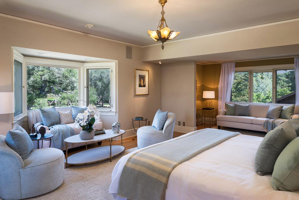 699 San Ysidro Road Montecito, CA 93108 - Photo 9 of 36 a living room with furniture and a chandelier
