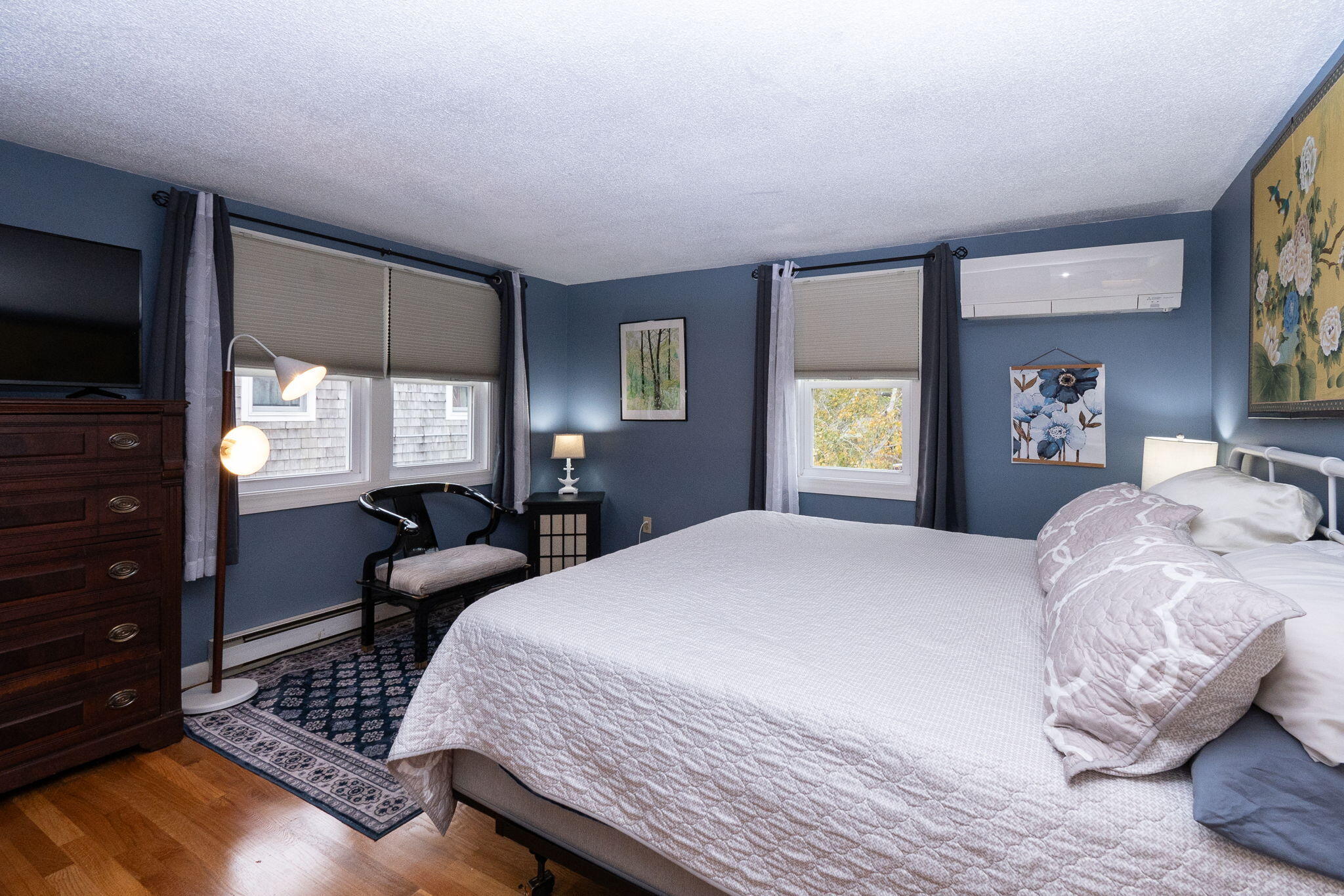 102 Sea Street Dennis Port, MA 02639 - Photo 14 of 40 a bedroom with a bed and wooden floor