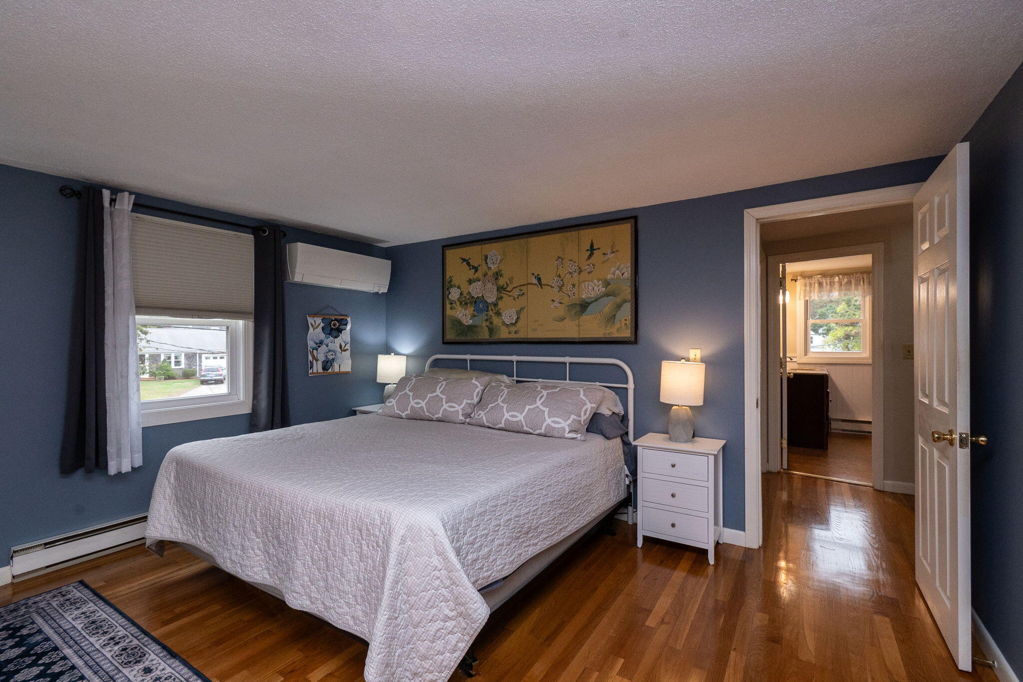 102 Sea Street Dennis Port, MA 02639 - Photo 15 of 40 a bedroom with a bed and wooden floor