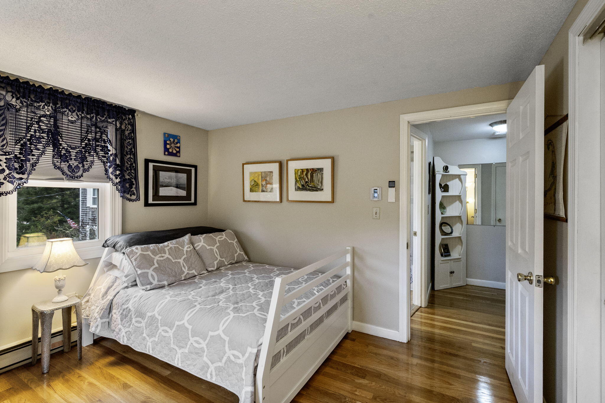 102 Sea Street Dennis Port, MA 02639 - Photo 19 of 40 a bedroom with a bed and a view of bathroom