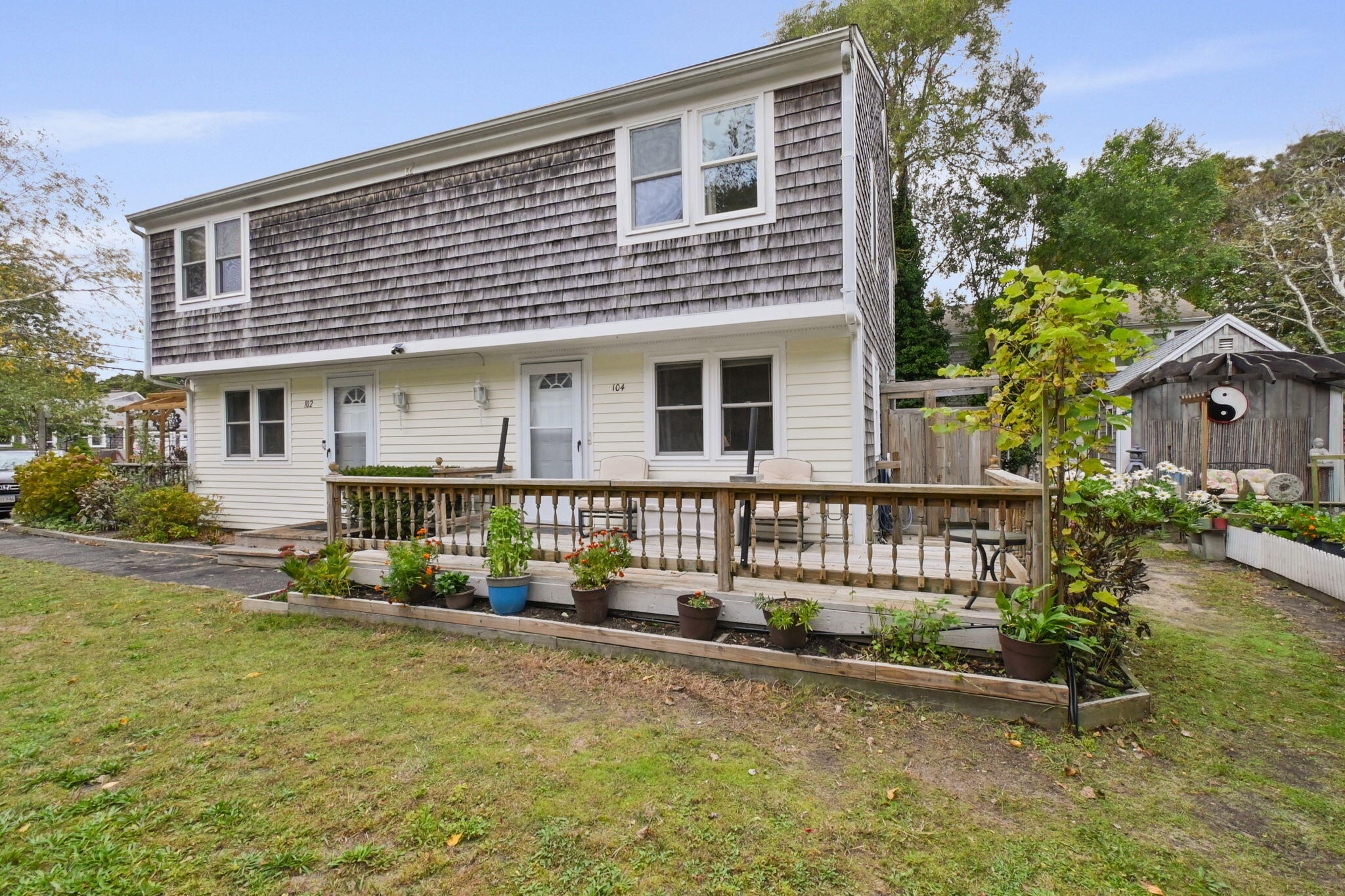 102 Sea Street Dennis Port, MA 02639 - Photo 2 of 40 front view of a house with a yard