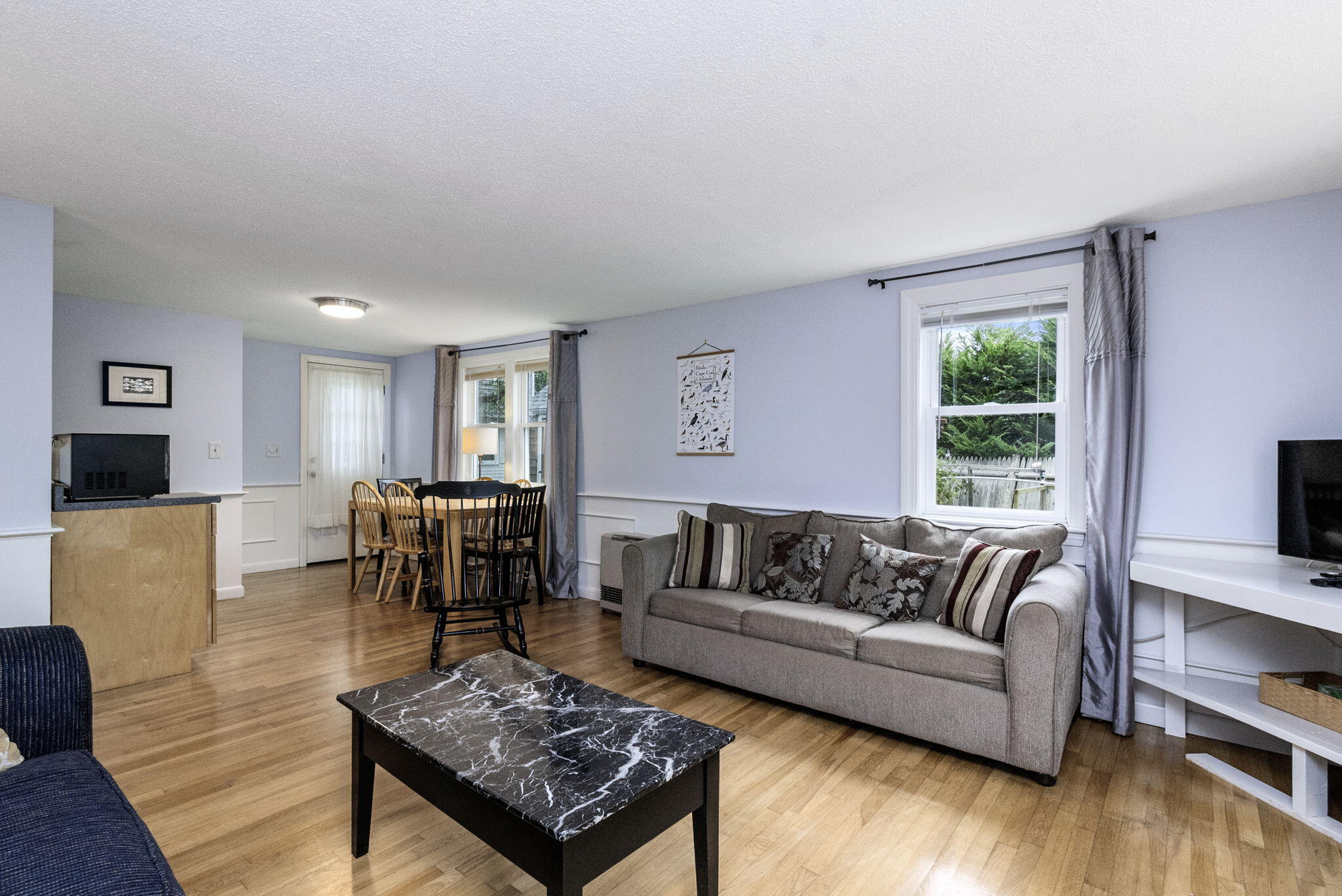 102 Sea Street Dennis Port, MA 02639 - Photo 23 of 40 a living room with furniture and a table