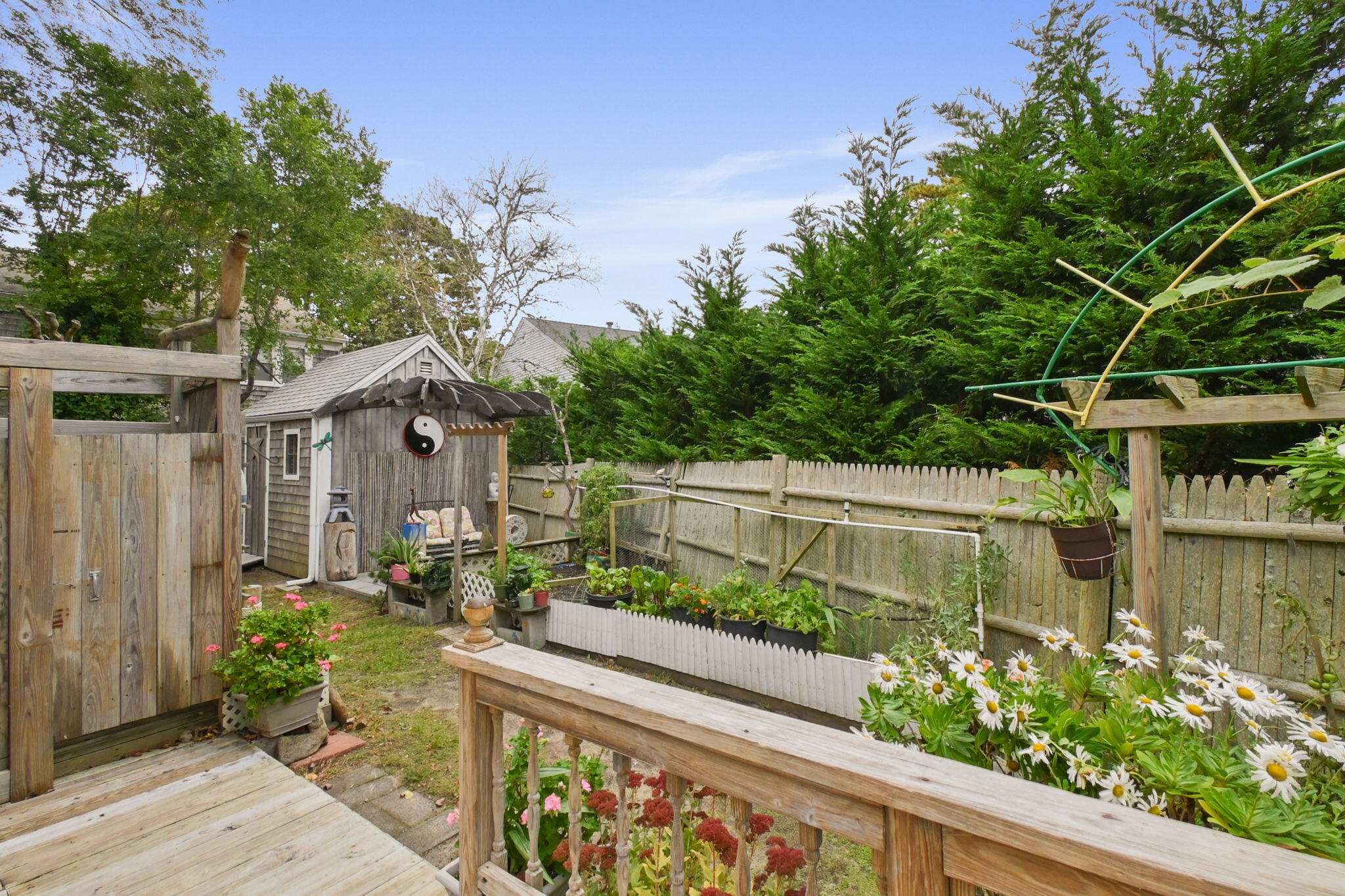 102 Sea Street Dennis Port, MA 02639 - Photo 34 of 40 a view of a house with balcony next to a yard