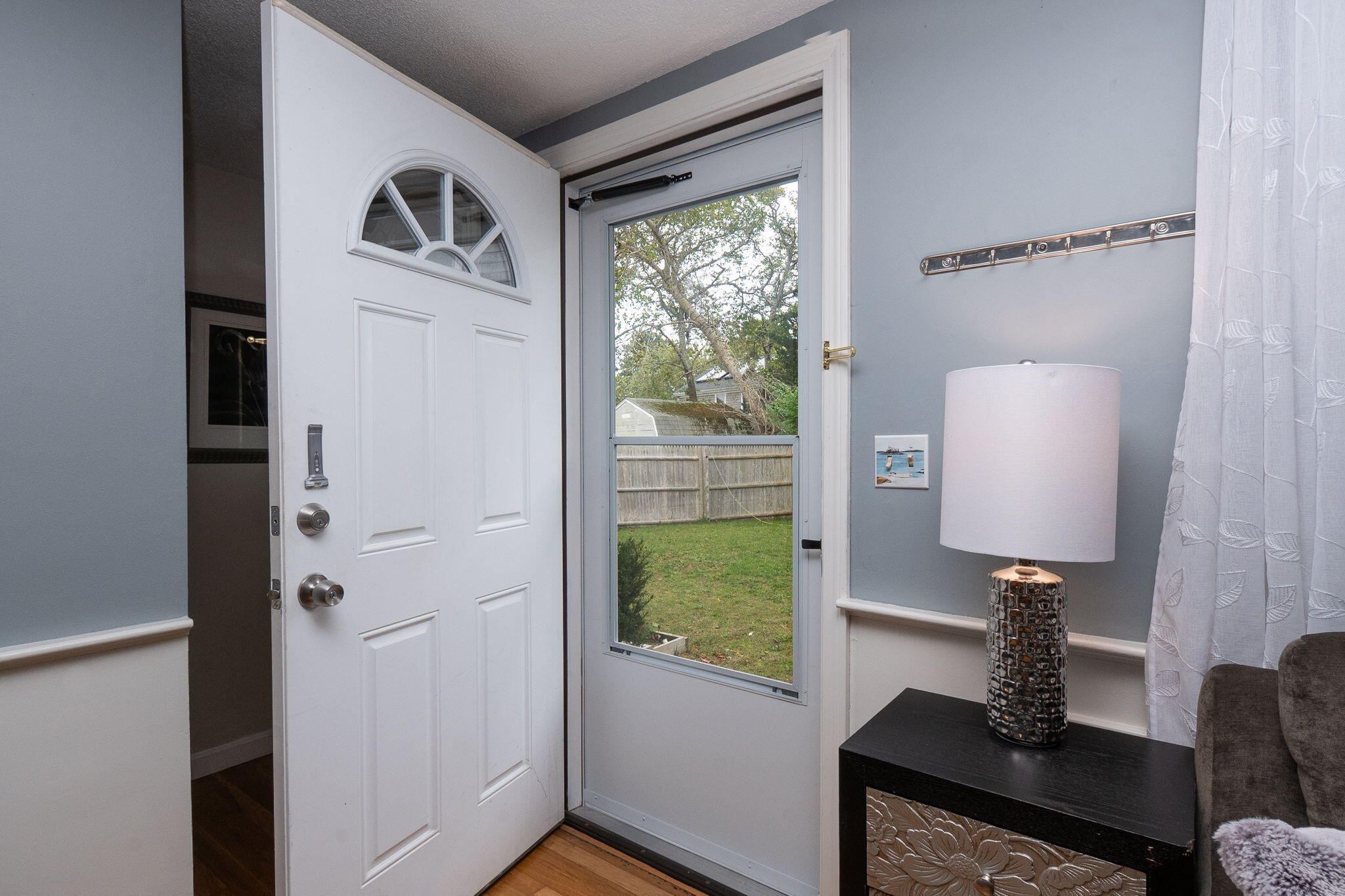 102 Sea Street Dennis Port, MA 02639 - Photo 4 of 40 a view of a workspace with furniture and a window