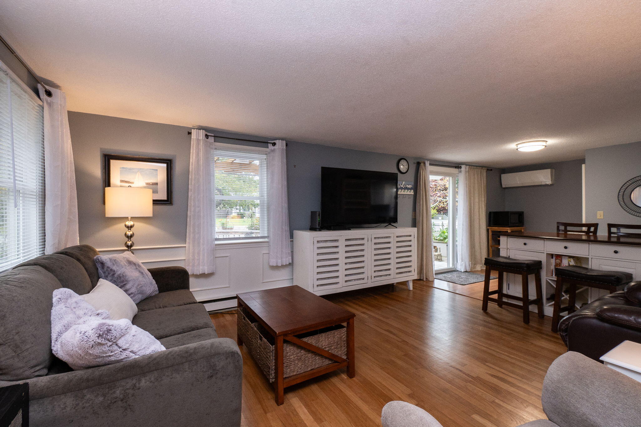 102 Sea Street Dennis Port, MA 02639 - Photo 5 of 40 a living room with furniture and a flat screen tv