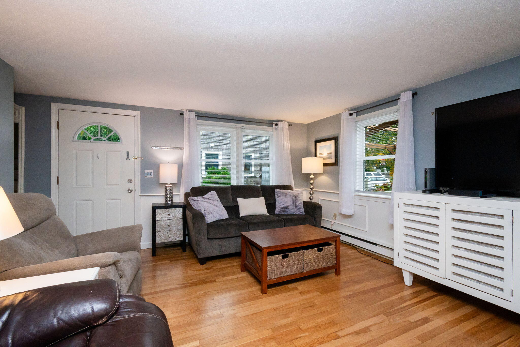 102 Sea Street Dennis Port, MA 02639 - Photo 6 of 40 a living room with furniture and a flat screen tv