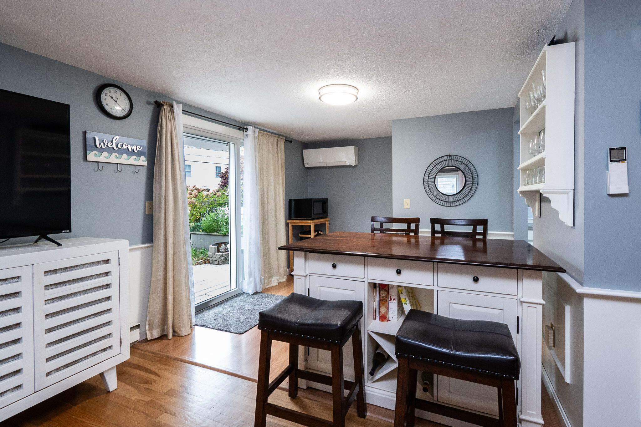 102 Sea Street Dennis Port, MA 02639 - Photo 7 of 40 a kitchen with a table and chairs in it