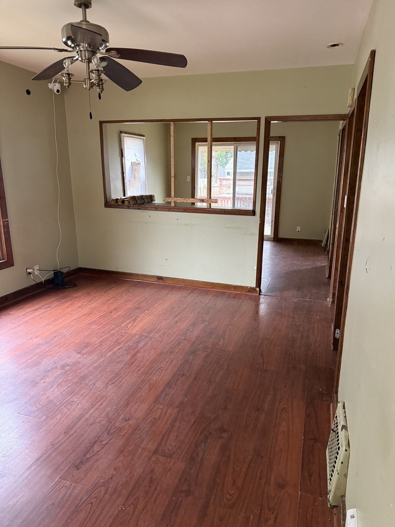 393 North 6th Avenue Kankakee, IL 60901 - Photo 4 of 11 wooden floor in an empty room with a window