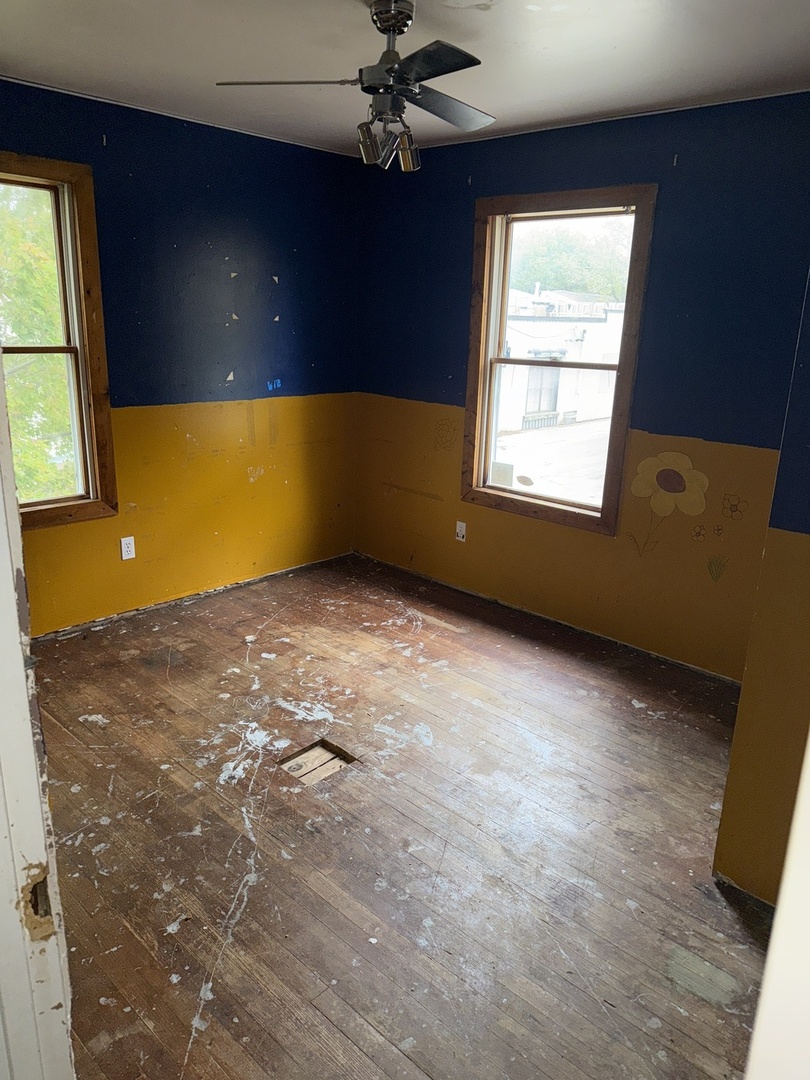 393 North 6th Avenue Kankakee, IL 60901 - Photo 9 of 11 a view of an empty room with a window