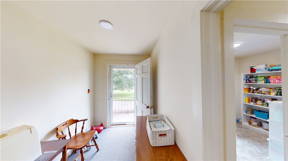 415 Church Street Pendleton, SC 29670 - Photo 19 of 35 A welcoming entry area provides seamless access to the outdoors, complemented by an adjacent, neatly organized pantry.