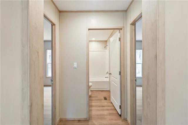 a kitchen with a sink stove and wooden cabinets
